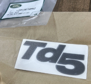 DAM100750MNZ - Badge – TD5  by Land RoverBody Part Land Rover Range Rover Discovery