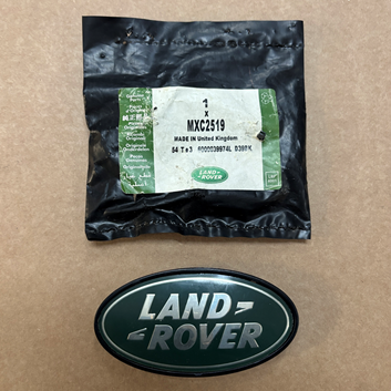 MXC2519 - Rear Door Lock Cover Badge  by Land RoverBody Part Land Rover Range Rover Discovery